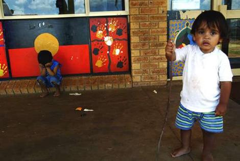 Troubled turf … small children linger outside the community
centre on the Gordon Estate, where the violence flared.